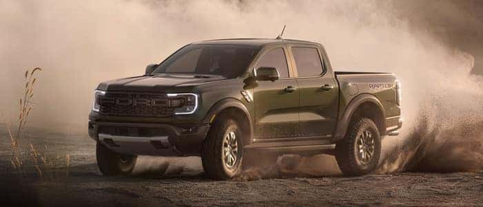 Green Ford Ranger driving in the dirt