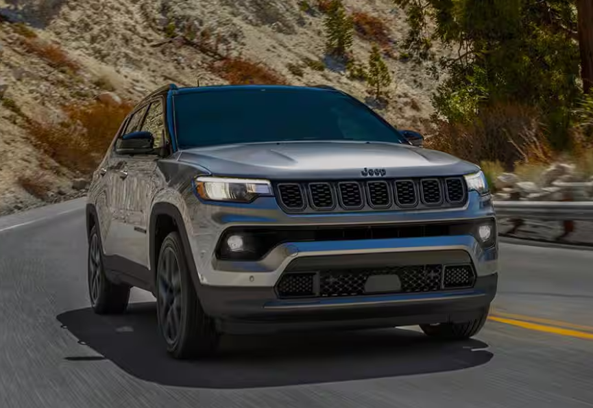 Gray 2026 Jeep Compass driving on road