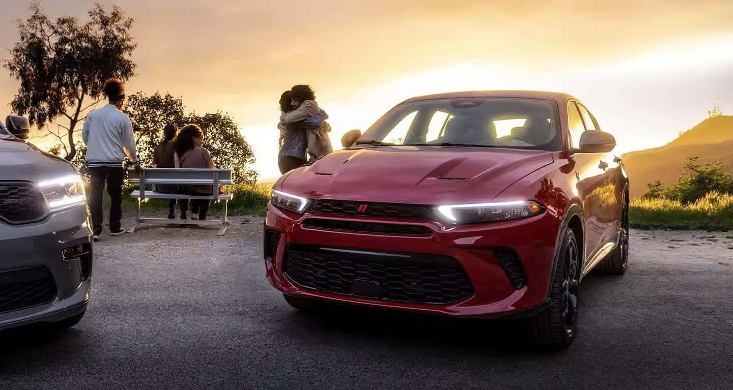 Dodge Hornet parked in parking lot with sunset