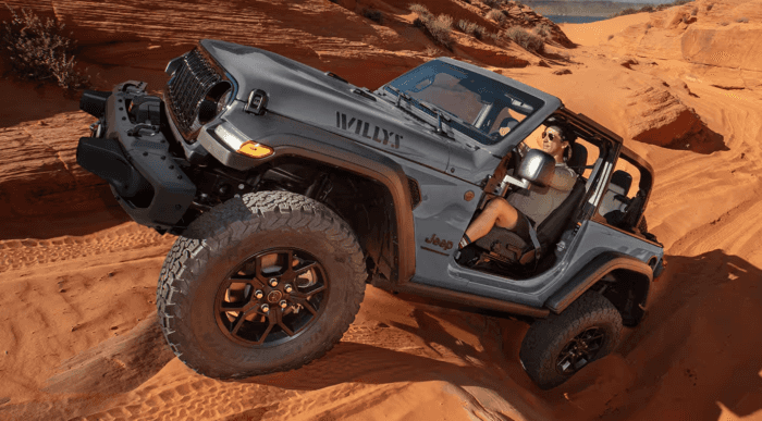 Gray 2025 Jeep Wrangler Willys driving uphill