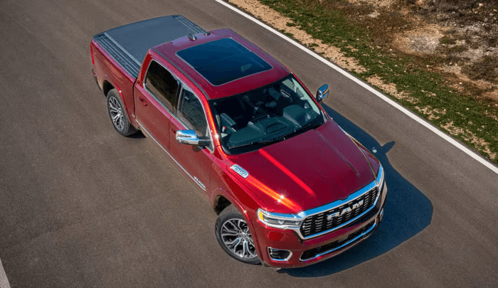 Ram 1500 pickup truck driving on open road