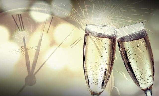 Glasses coming together for new years celebration