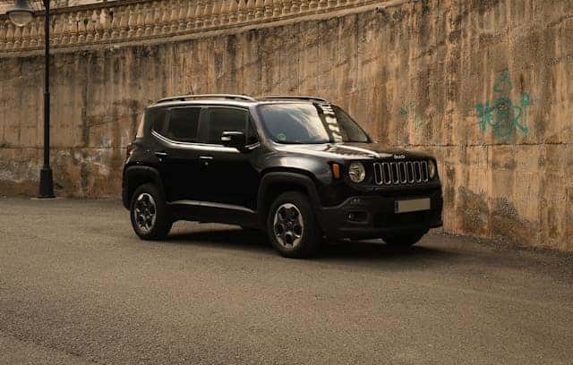 Black jeep renegade parked