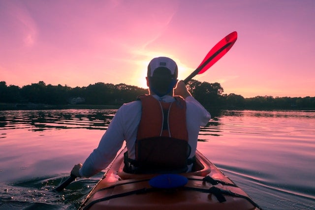 Man riding on kayak