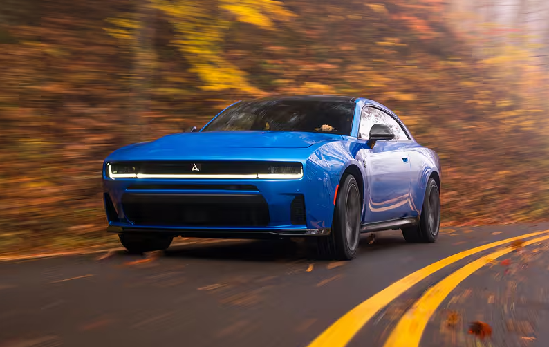 Blue 2026 Dodge Charger driving on road