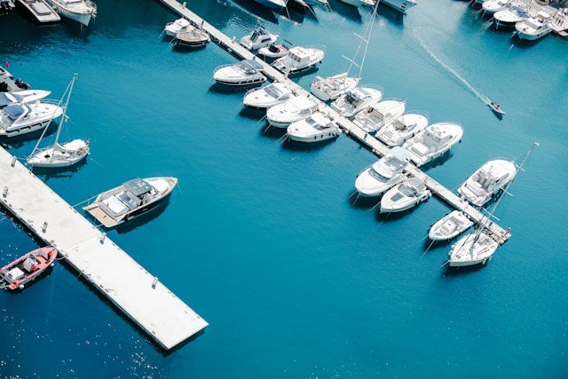White boat on a body of water during daytime