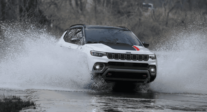 2025 Jeep Compass driving through the water