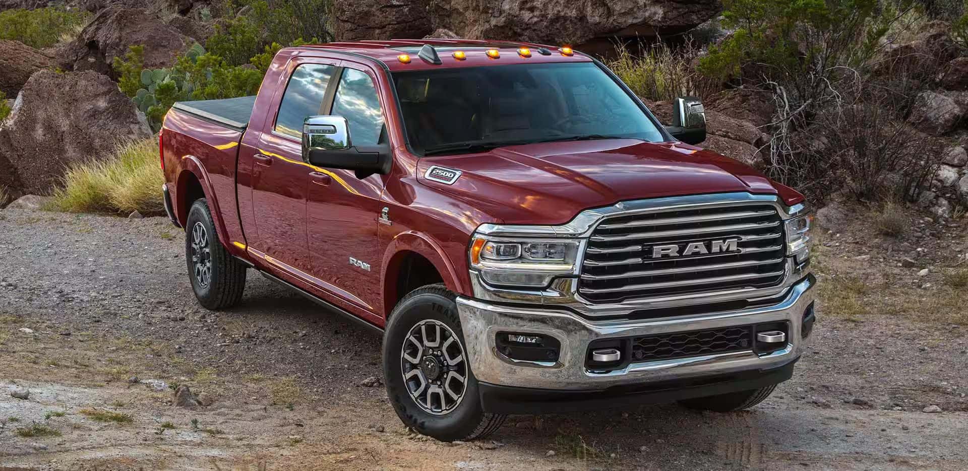 Red Ram 2500 parked on dirt