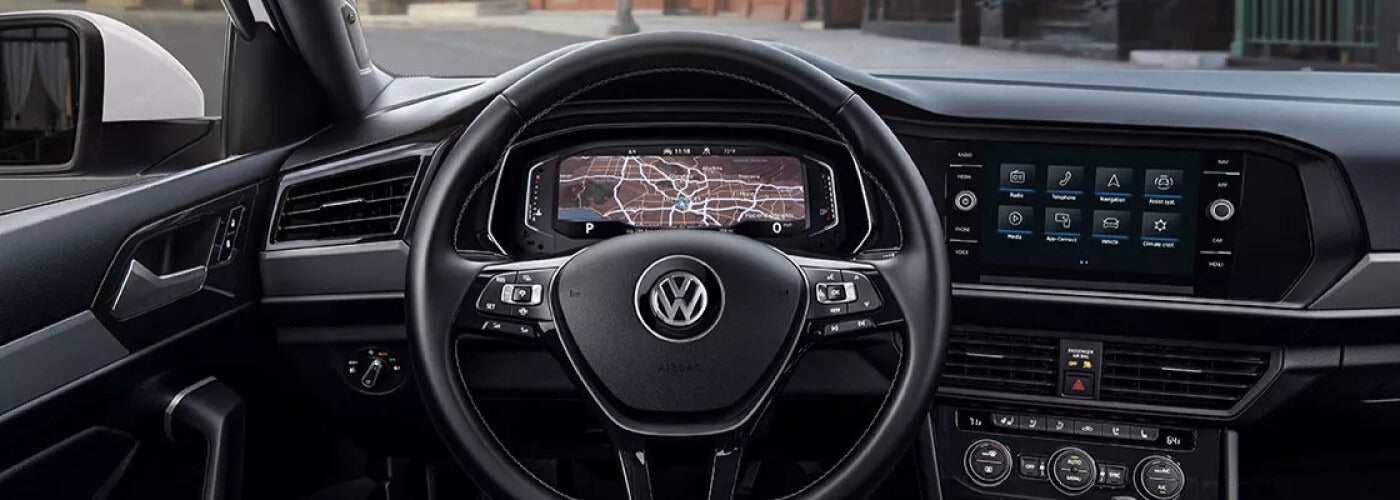 interior view of steering wheel and dashboard of a Volkswagen