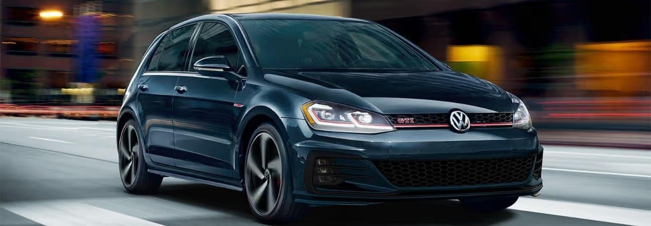 2019 Golf GTI in black driving in a city