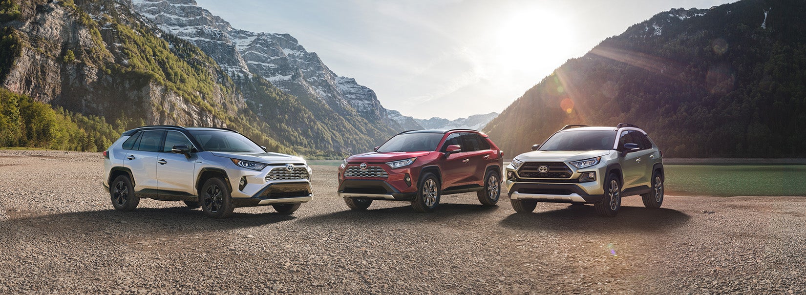 Bennett Toyota of Lebanon is a Car Dealership near Cleona, PA | Multiple 2020 Toyota RAV4 vehicles parked in front of mountains