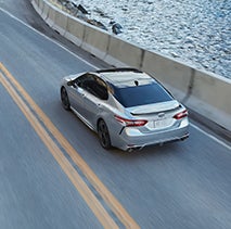 Model Features of the 2022 Toyota Camry at Bennett Toyota of Lebanon | Camry driving by river