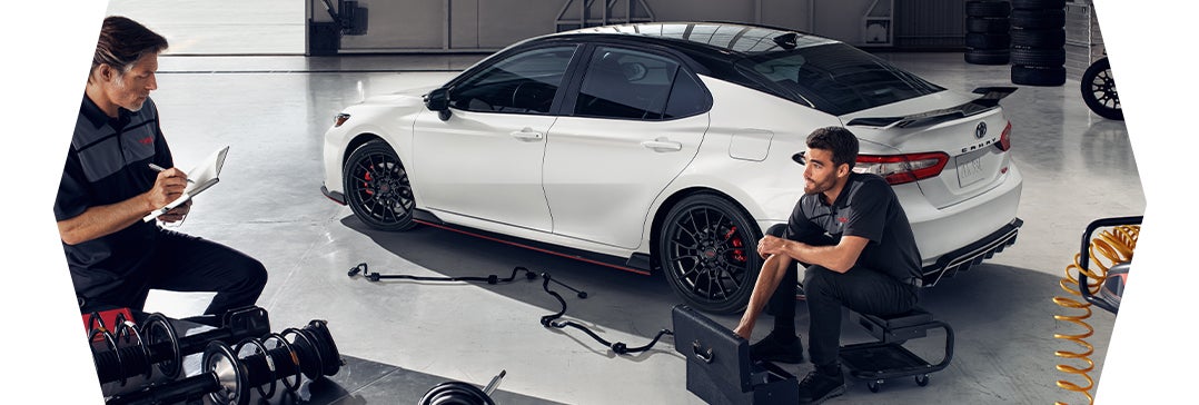 How to prepare your Toyota for the winter season in Lebanon, PA at Bennett Toyota of Lebanon | Two Toyota Technicians work on Camry TRD