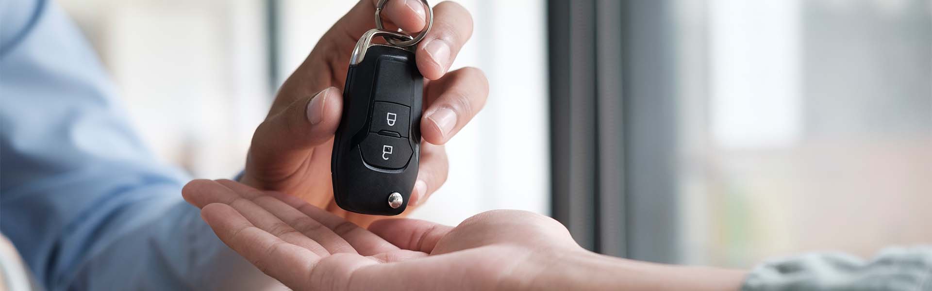 defining APR at Bennett Toyota of Lebanon in Lebanon | Sales Advisor Handing New Car Keys Over to Customer