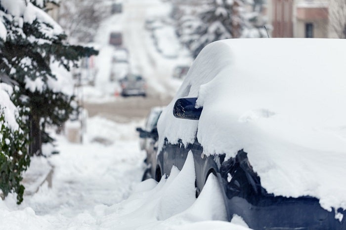 Cars and roads covered with snow