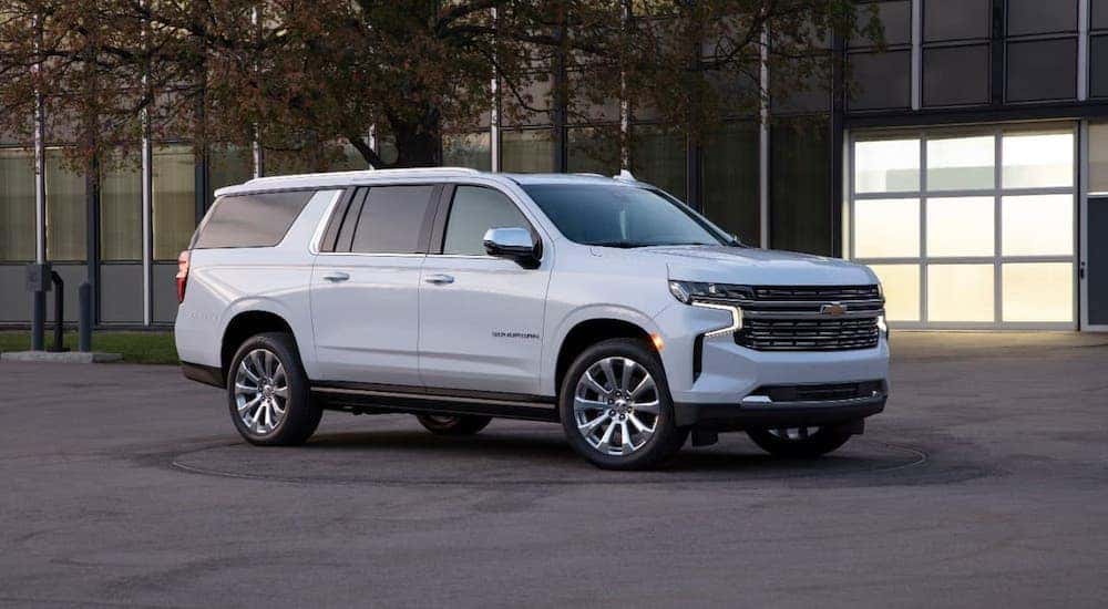A white 2021 Chevy Suburban is parked in front of a Chevy dealer near Lexington, KY.