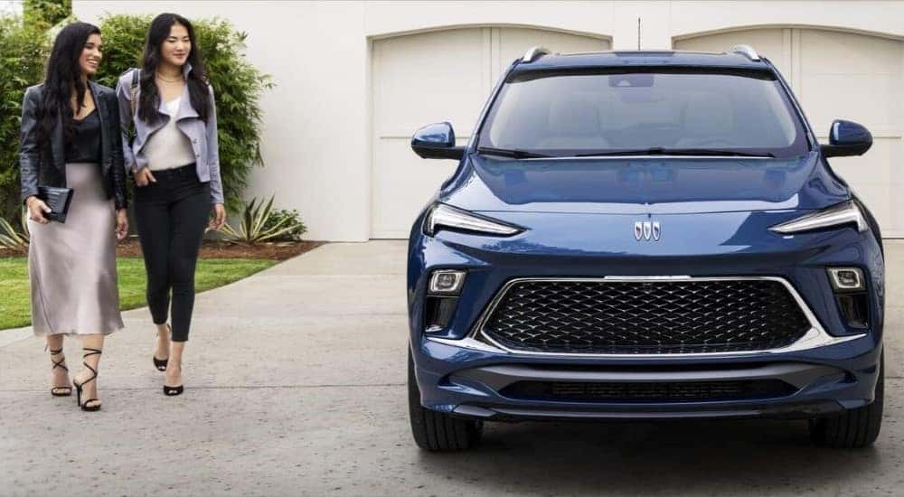 A blue 2024 Buick Encore GX Avenir is shown on a driveway after leaving a Buick dealer near Winchester.