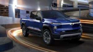 blue 2024 Chevrolet Silverado EV driving through Paris, KY 