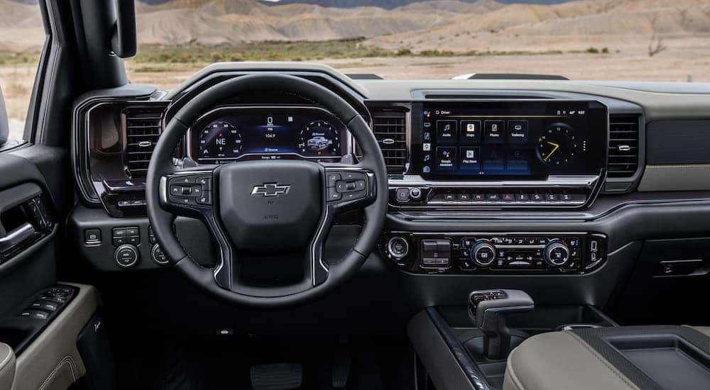 The black interior of a 2024 Chevy Silverado 1500 ZR2 is shown from the drivers seat.