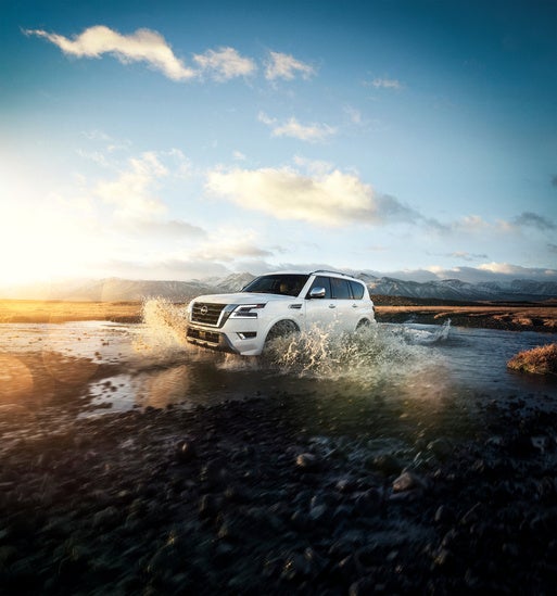 2022 Kia Armada driving in water stream.