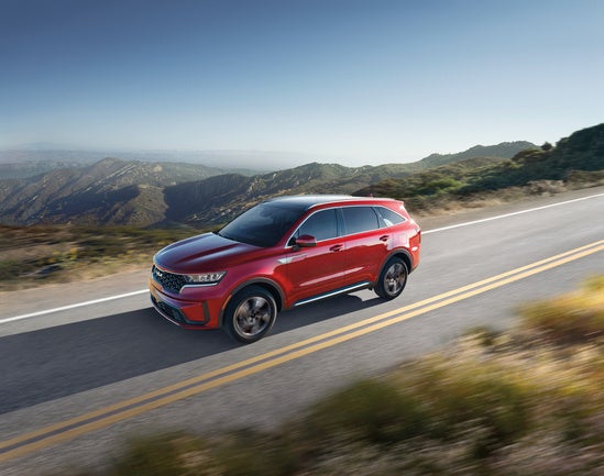 Kia Sorento Hybrid on mountain roads.