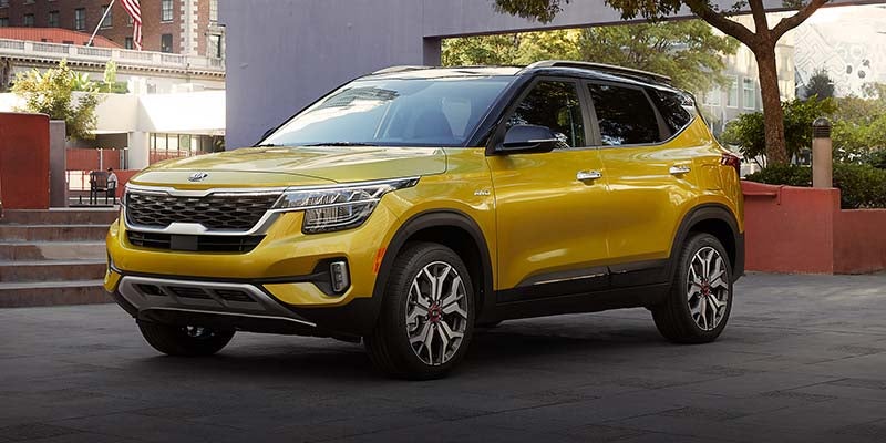 2021 Kia Seltos parked on a city street, showcasing its modern design.