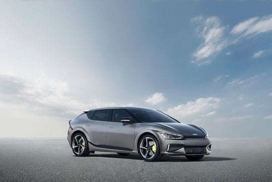 High tech EV6 parked on a vast, empty asphalt surface.