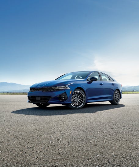 Kia K5 standing in a bright environment.