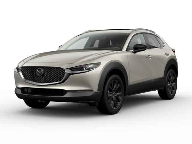  Mazda CX-30 SUV parked on a city street, showcasing its sleek design and modern features.