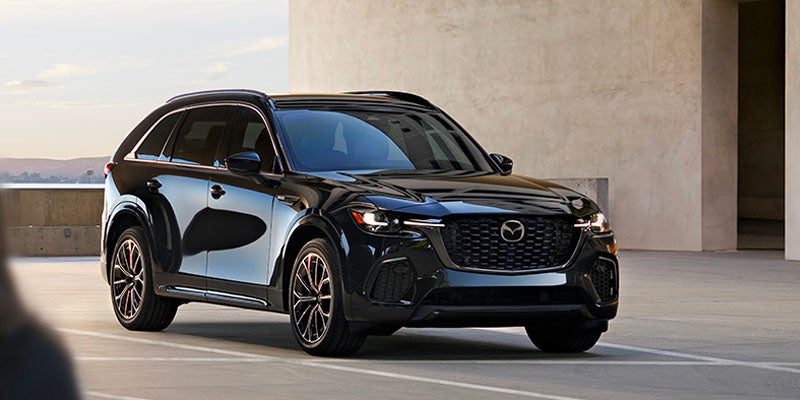 Mazda CX-70 compact SUV displayed in various colors, showcasing its sleek design and versatility.