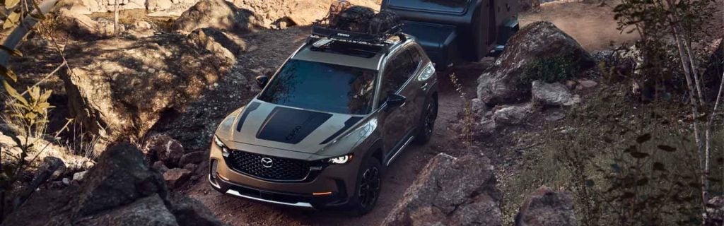 The image presents a Mazda, highlighting its stylish exterior and contemporary design elements.