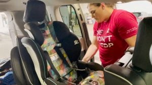 A photo of Bobbi Jo Brocka Installing a carseat