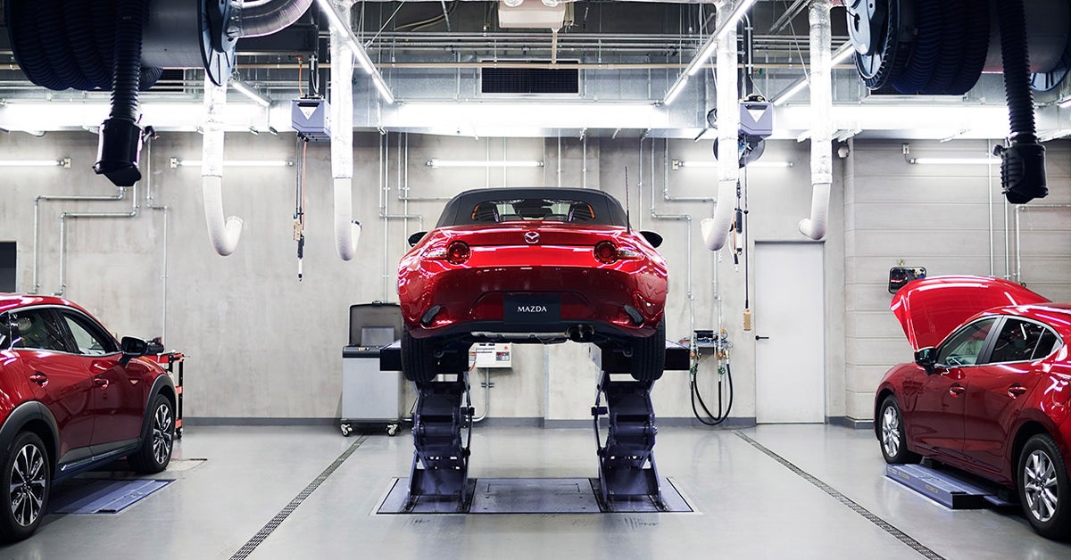 Car in the service bay for its Mazda service schedule