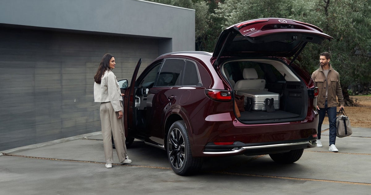 Mazda CX-90 rear cargo area open with luggage loaded