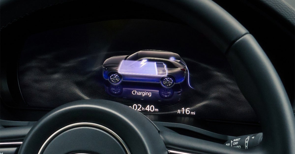 Mazda CX-90 digital gauge cluster showing EV charging status