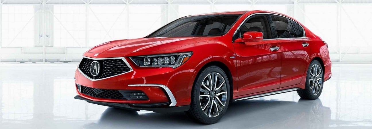 A red 2019 Acura RLX parked in a white room