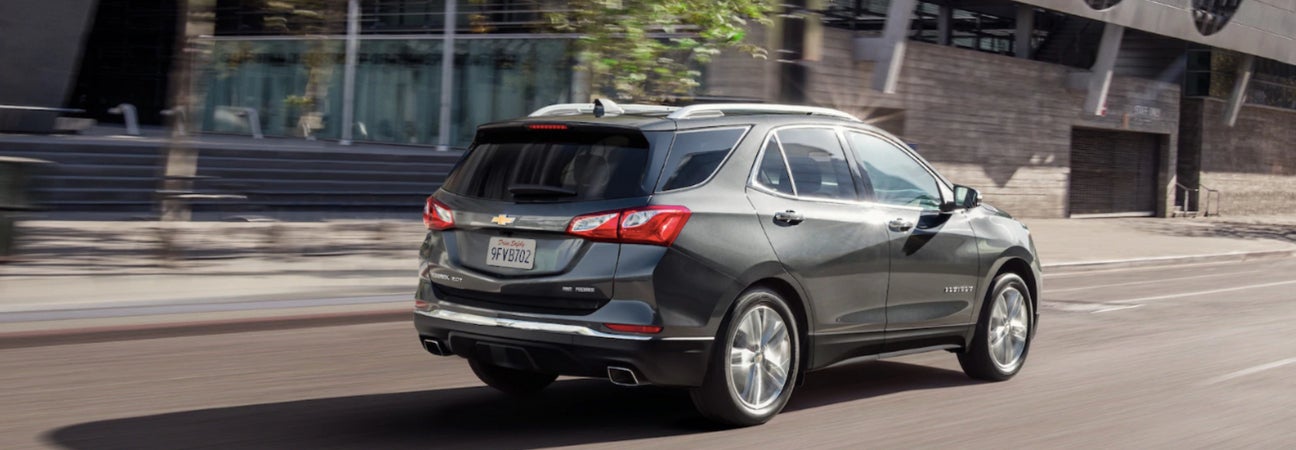 2019 Chevy Equinox driving down city street