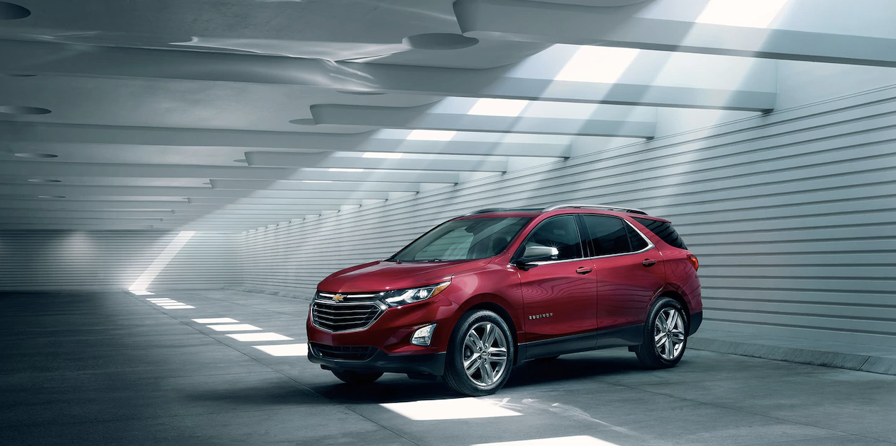 red chevy equinox in a garage