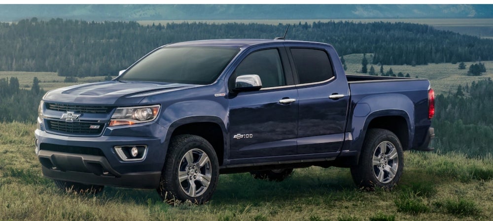 2018 Chevrolet Colorado Centennial Edition blue truck in field