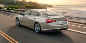 2024 Chevrolet Malibu cruising sea-side