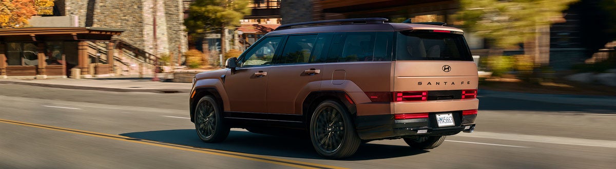 2026 Hyundai Santa Fe Hybrid Driving Down the Street