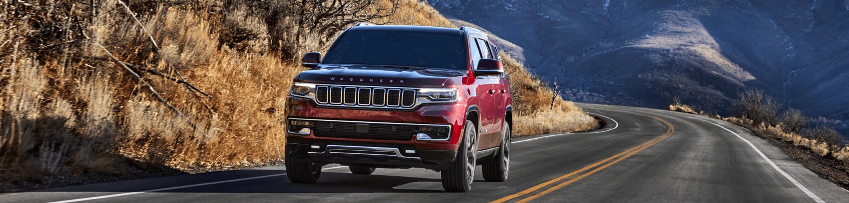 2022 Jeep Wagoneer Red Highway Distant Mountains