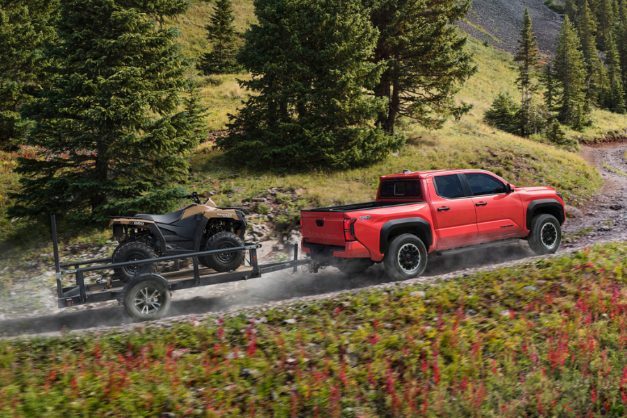 Red Toyota Tacoma towing