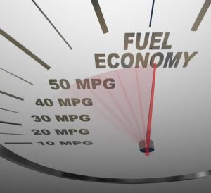 The words Fuel Economy on a vehicle speedometer with a red needle racing past numbers 10, 20, 30, 40, 50 MPG as the automobile achieves an improved efficiency r