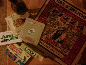 Pizza box with Redbox movie, Dots, and Junior Mints