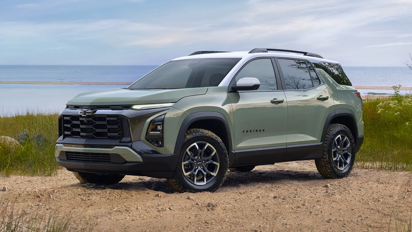 Green and white 2025 Chevrolet Equinox parked on the beachside
