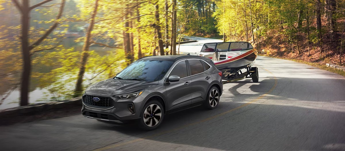 A 2025 Ford Escape pulling a boat behind it