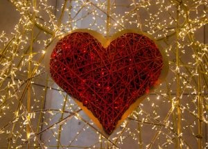 Red heart with lights around it.