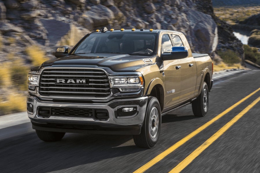 brown used RAM 1500 on road
