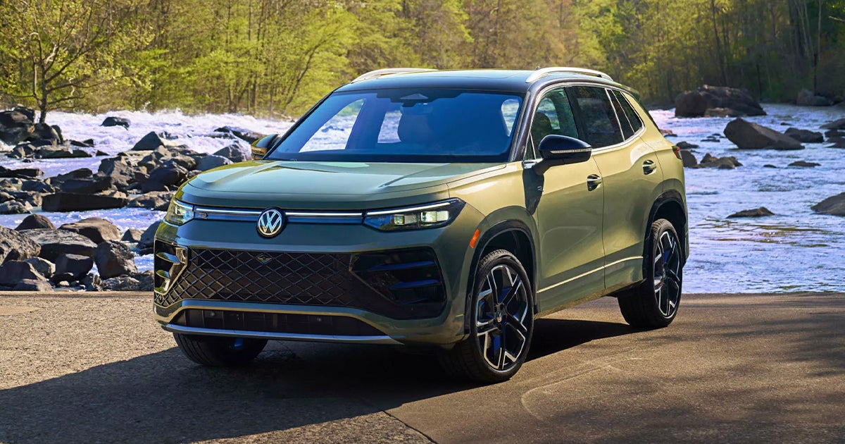 A Volkswagen Tiguan SEL R-Line parked by a river.